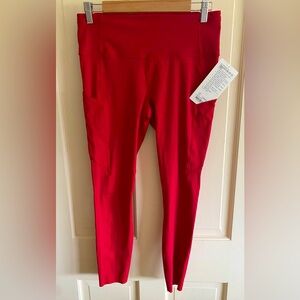 NWT LuluLemon. Size 10 Red Fast and Free HR 7/8 Tight.  Side drop-in pockets